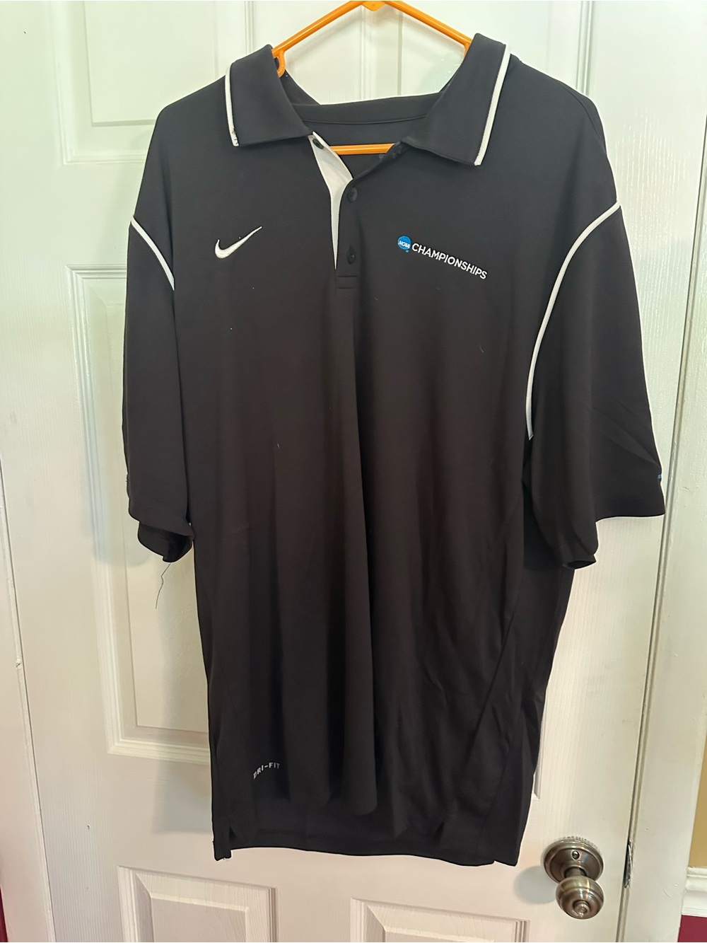 Nike Black Polo Shirt with White Trim and Championships Logo